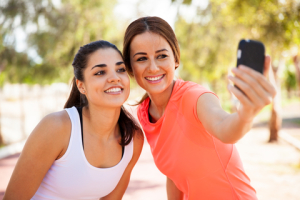 http://www.dreamstime.com/stock-image-runners-taking-selfie-beautiful-girls-smart-phone-going-run-outdoors-image44142641