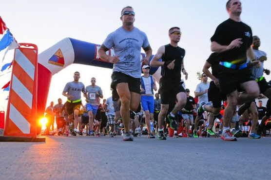 Runners take off from the starting line at the Commander's Cup Aquathon in Fort Bliss, Texas, in July 2014. (Photo by Sgt. James Avery/U.S. Army/flickr)