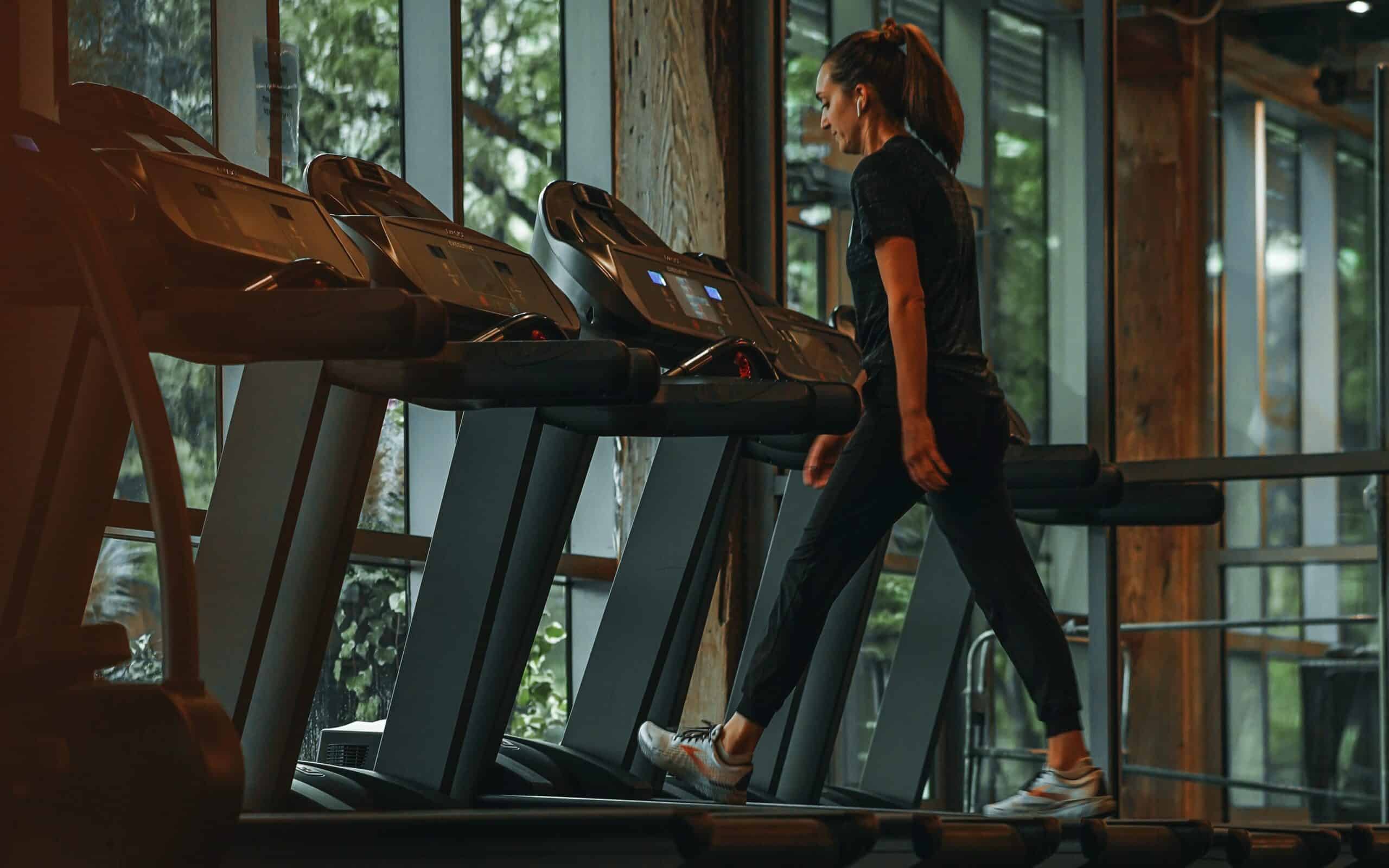 A runner in marathon training treadmill wearing Brooks shoes.