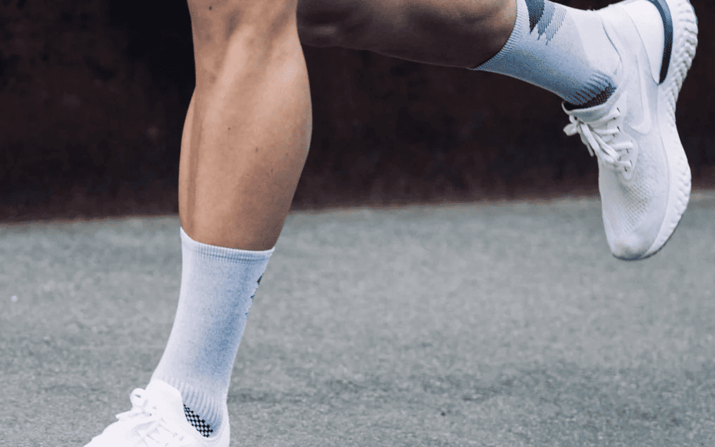 A Rocay Performance Sock in motion one of the essential marathon gear recommendations for any runner.