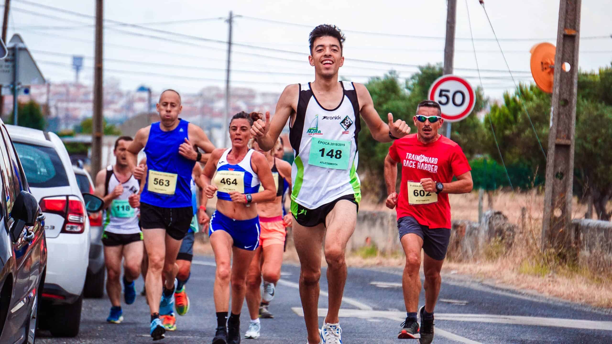 A smiling runner on the course with runner's high.