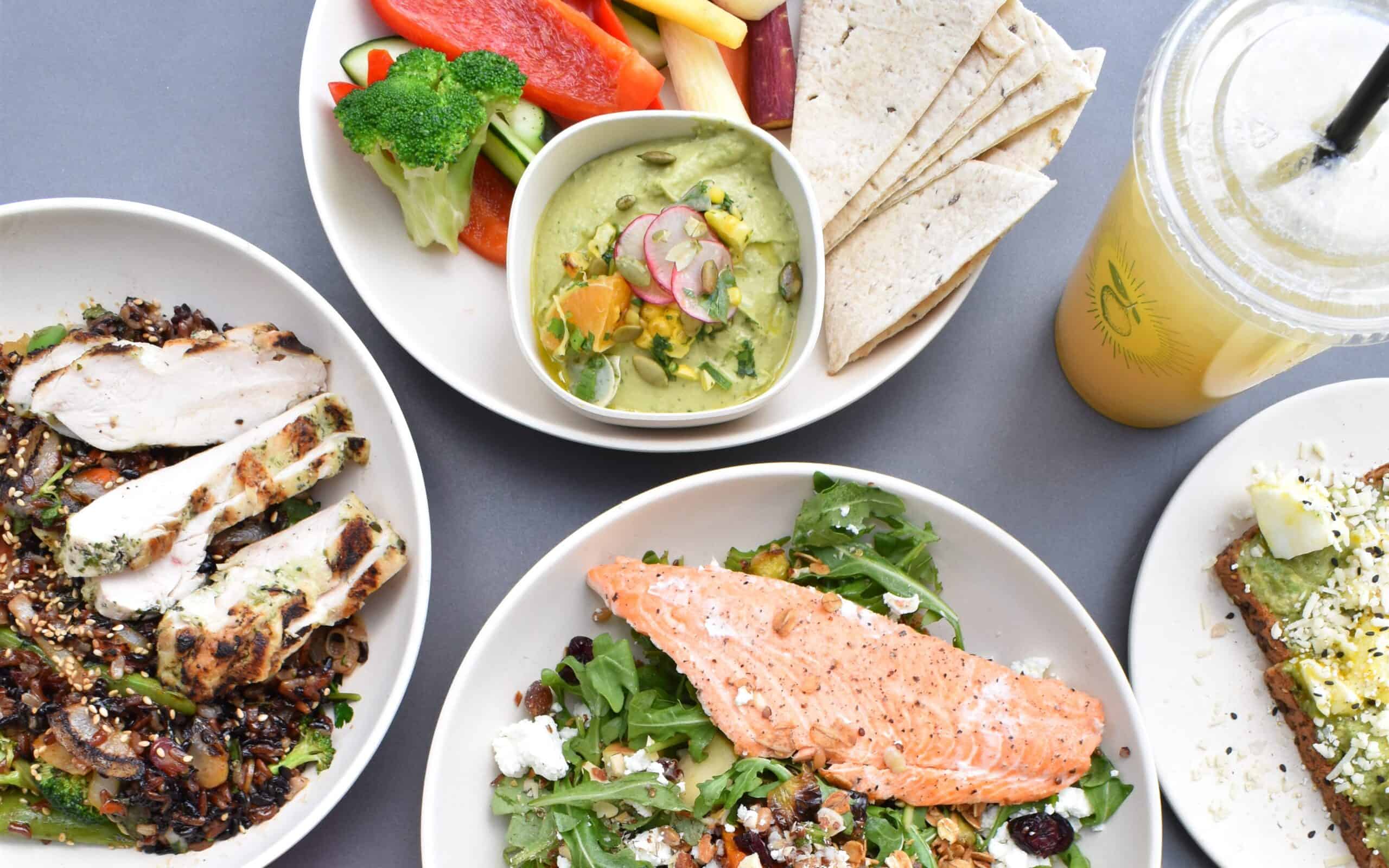 Salmon, chicken, hummus, pita and avocado toast as part of a marathon or long run training diet.