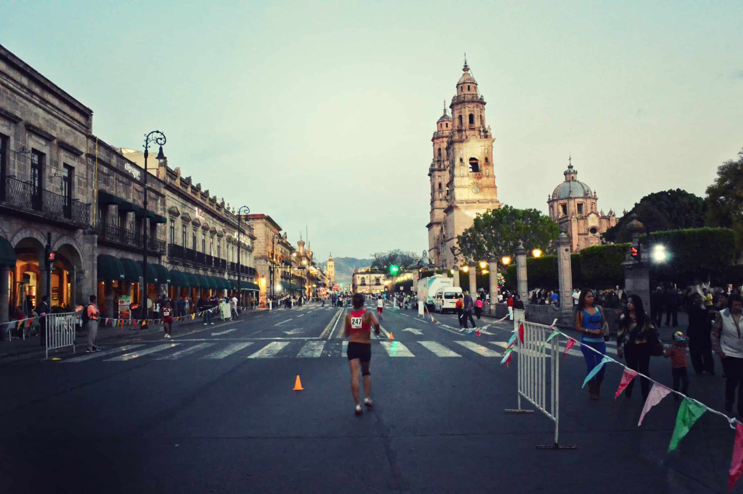 Valencia Marathon woman running down the race course. 