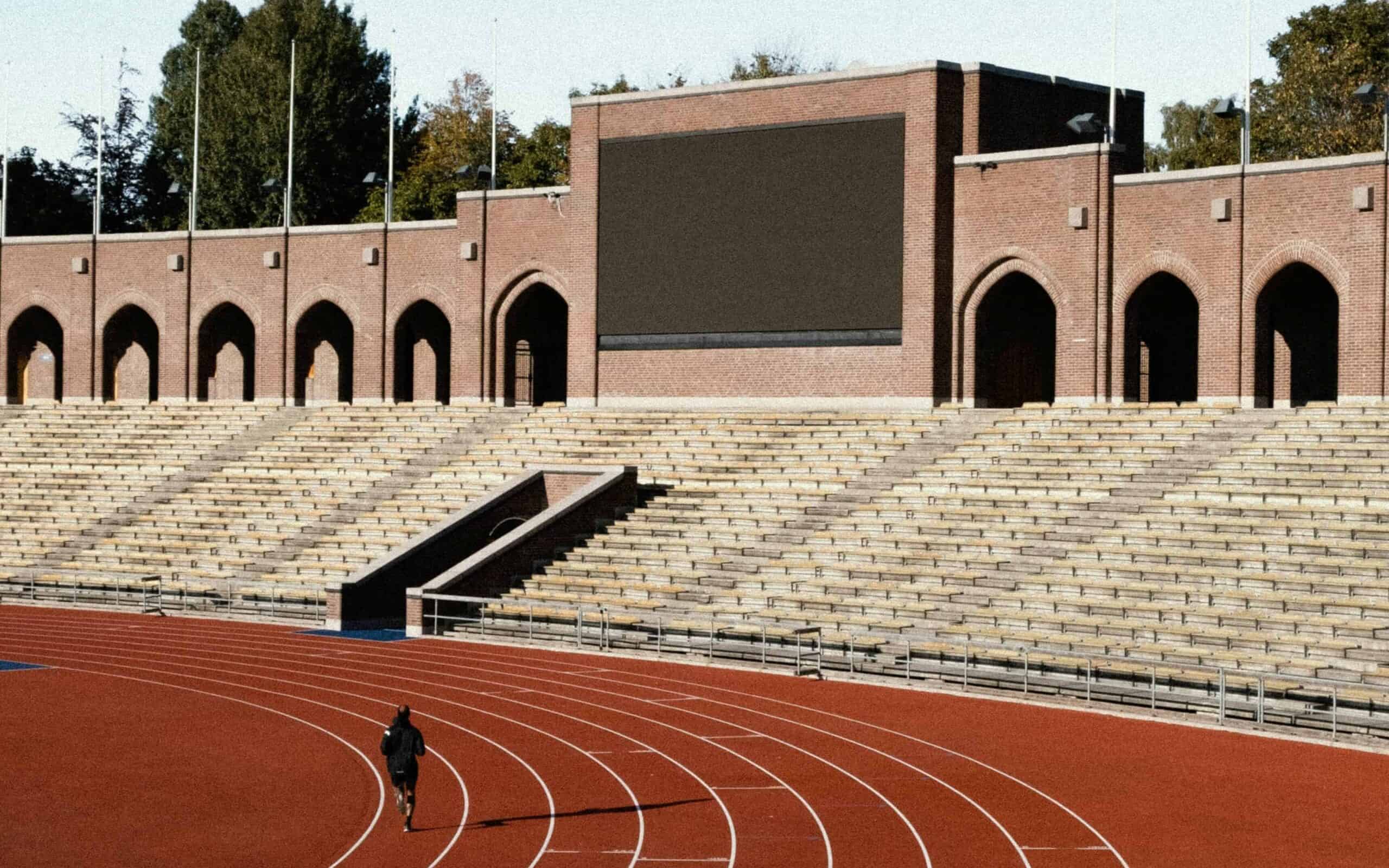 Runner on a track working on half marathon pacing.