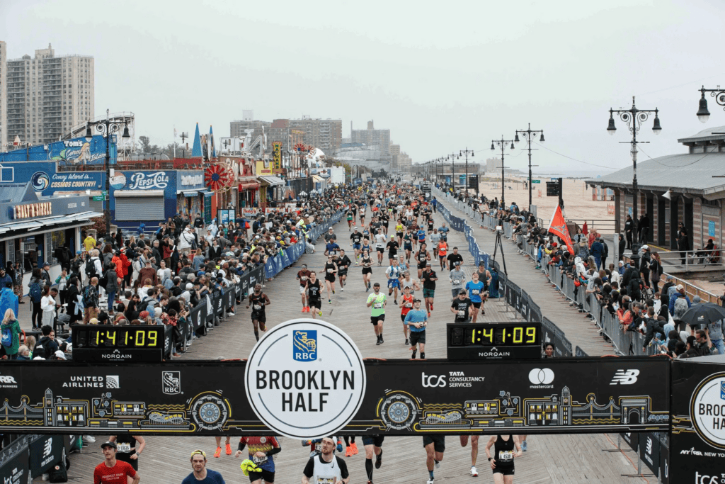 runners at the finish line of the NYRR RBC Brooklyn Half